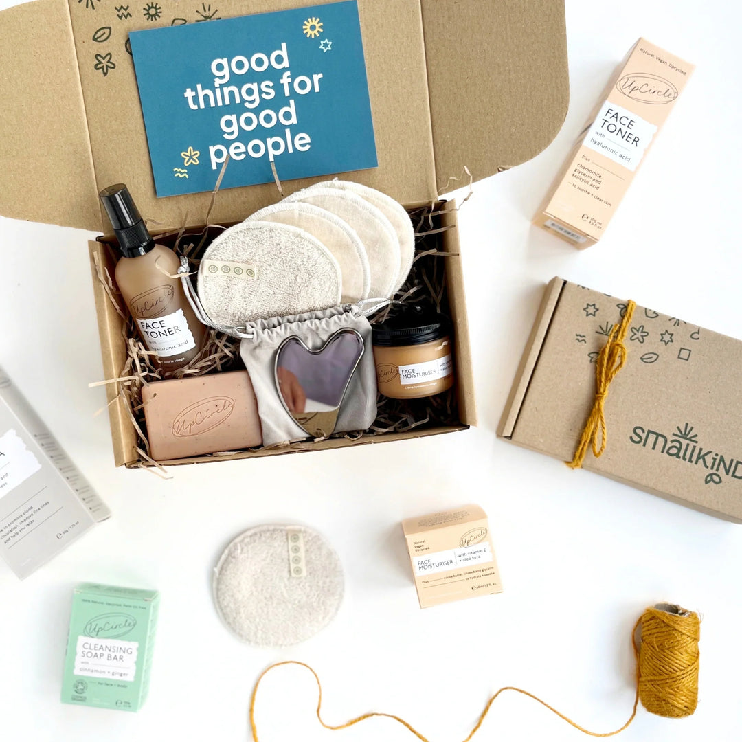 collection of facial skincare treatements with a gift box on a white background