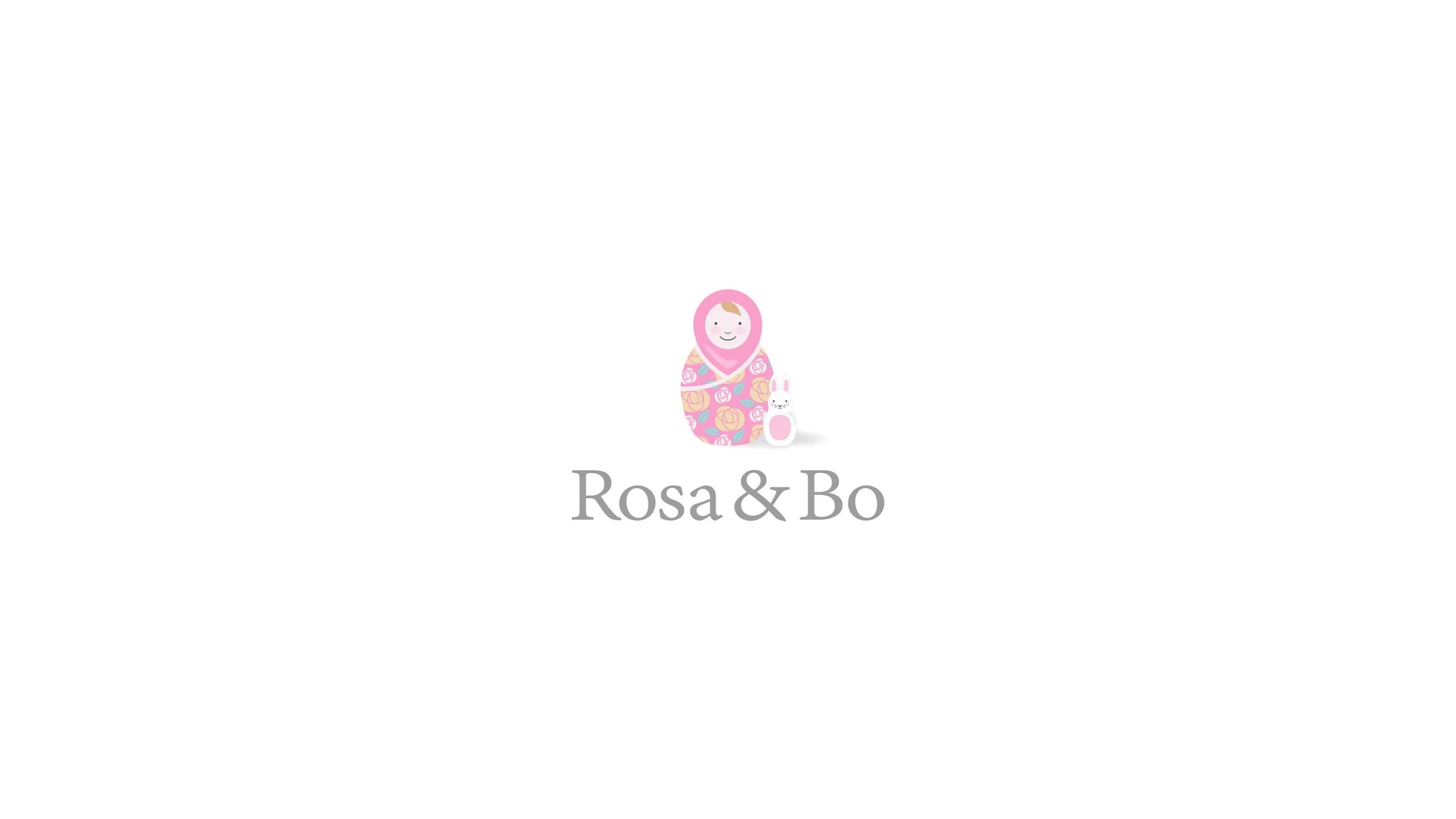 An illustration of a pink nesting doll and a white bunny with the words Rosa + Bo in a grey serif font underneath