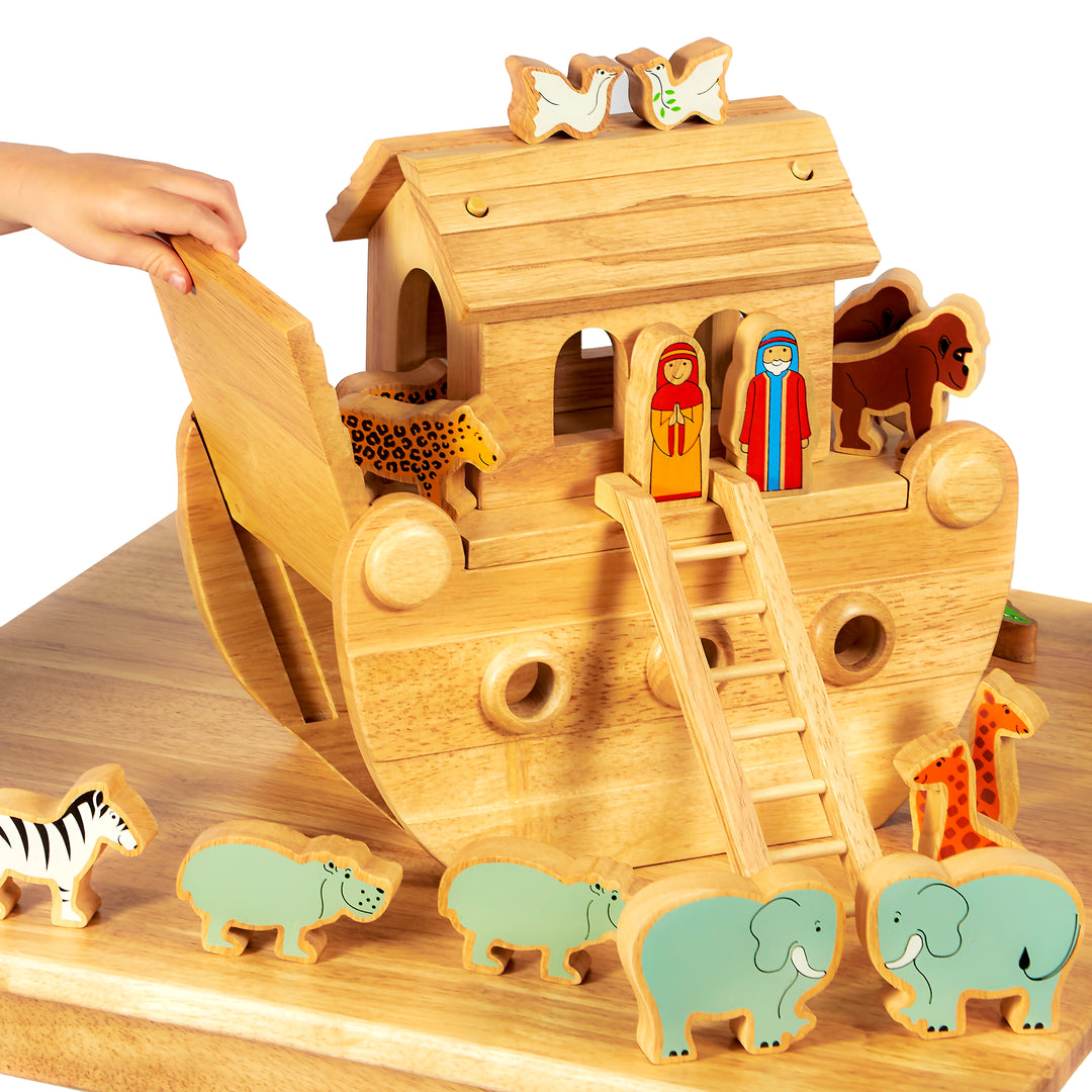 Wooden toy Noah's Ark with animals and figures on a wooden base