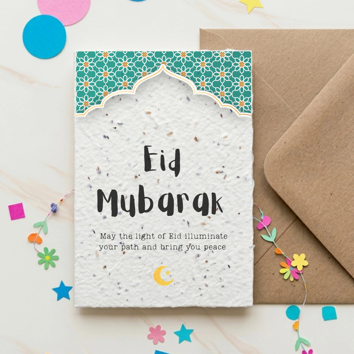 Eid Mubarak card with a traditional arch design and the words 'may the might of Eid illuminate your path and bring you peace'. 