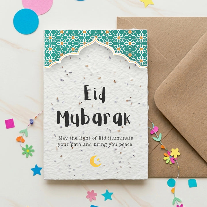 Eid Mubarak card with a traditional arch design and the words 'may the might of Eid illuminate your path and bring you peace'. 