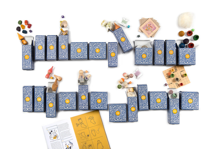 Grapat advent calendar including 24 blue and yellow printed boxes with a variety of wooden peg dolls, loose parts and craft activities. For children age 3 and over. 