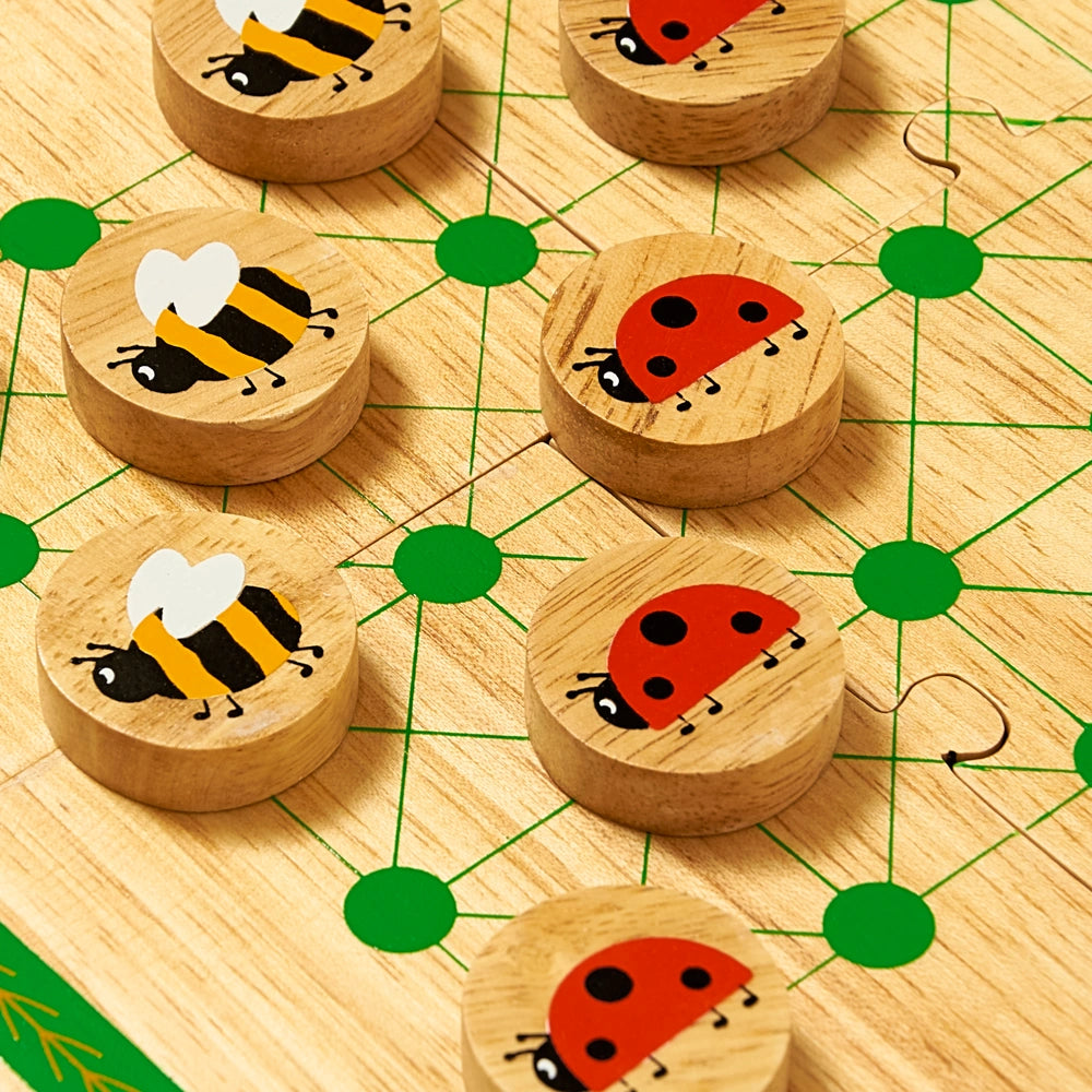 close up of ladybird and bee game pieces from the lanka Kade wooden Minibeast travel Board Game. Strategy game for age 3+