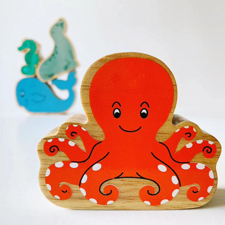 lanka kade orange wooden octopus figure for small world play with other sea creatures in the background