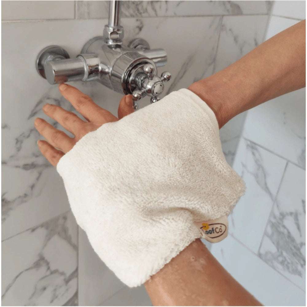 White woman using LoofCo Egyptian Cotton Cleansing Mitt, a sustainable and luxurious addition to your bath or shower routine