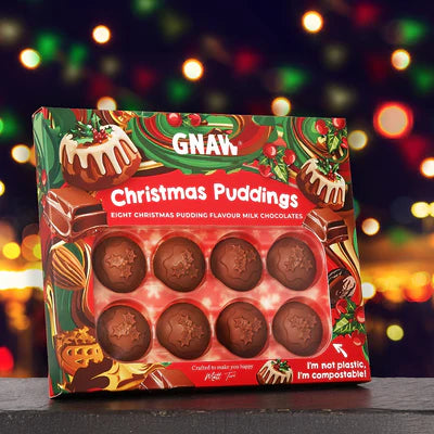 Box of Gnaw chocolate Christmas Puddings with a festive background