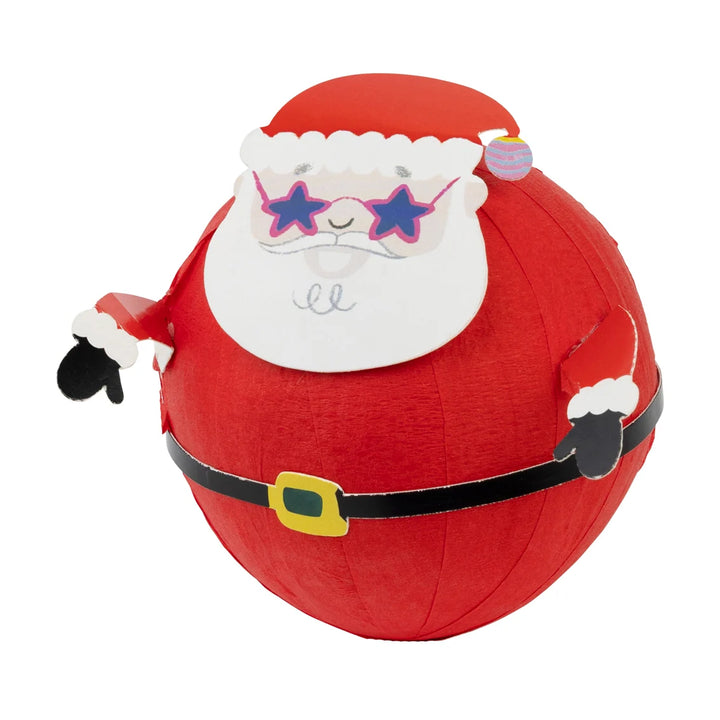 Red plush ball with Santa Claus face and sunglasses on a white background