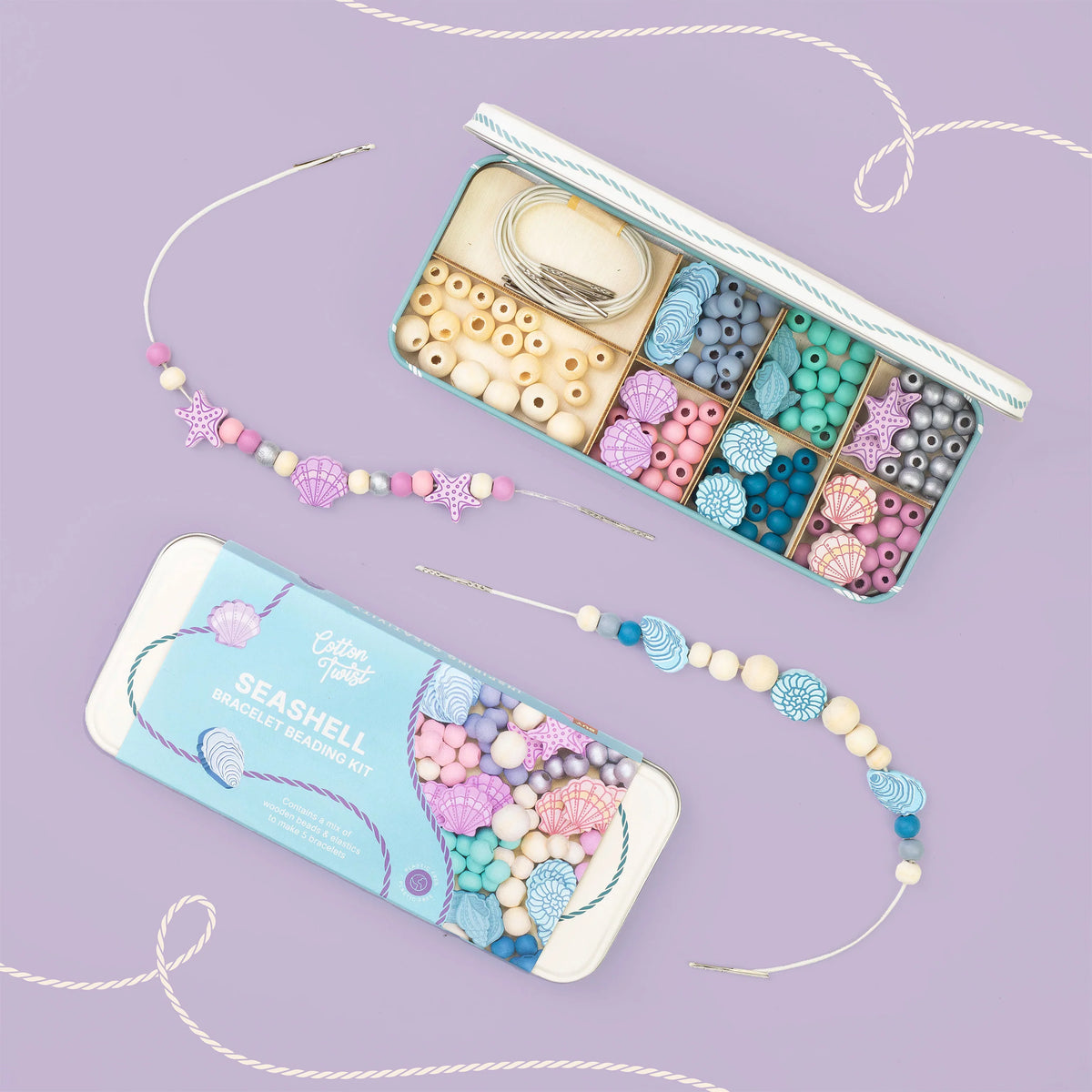 Beaded necklace set with packaging on a purple background