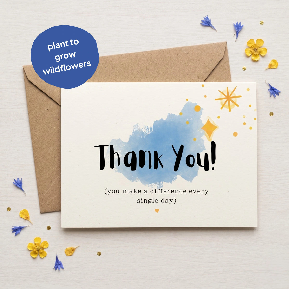 Greeting card with 'Thank You!' message and envelope on a light background with flowers.