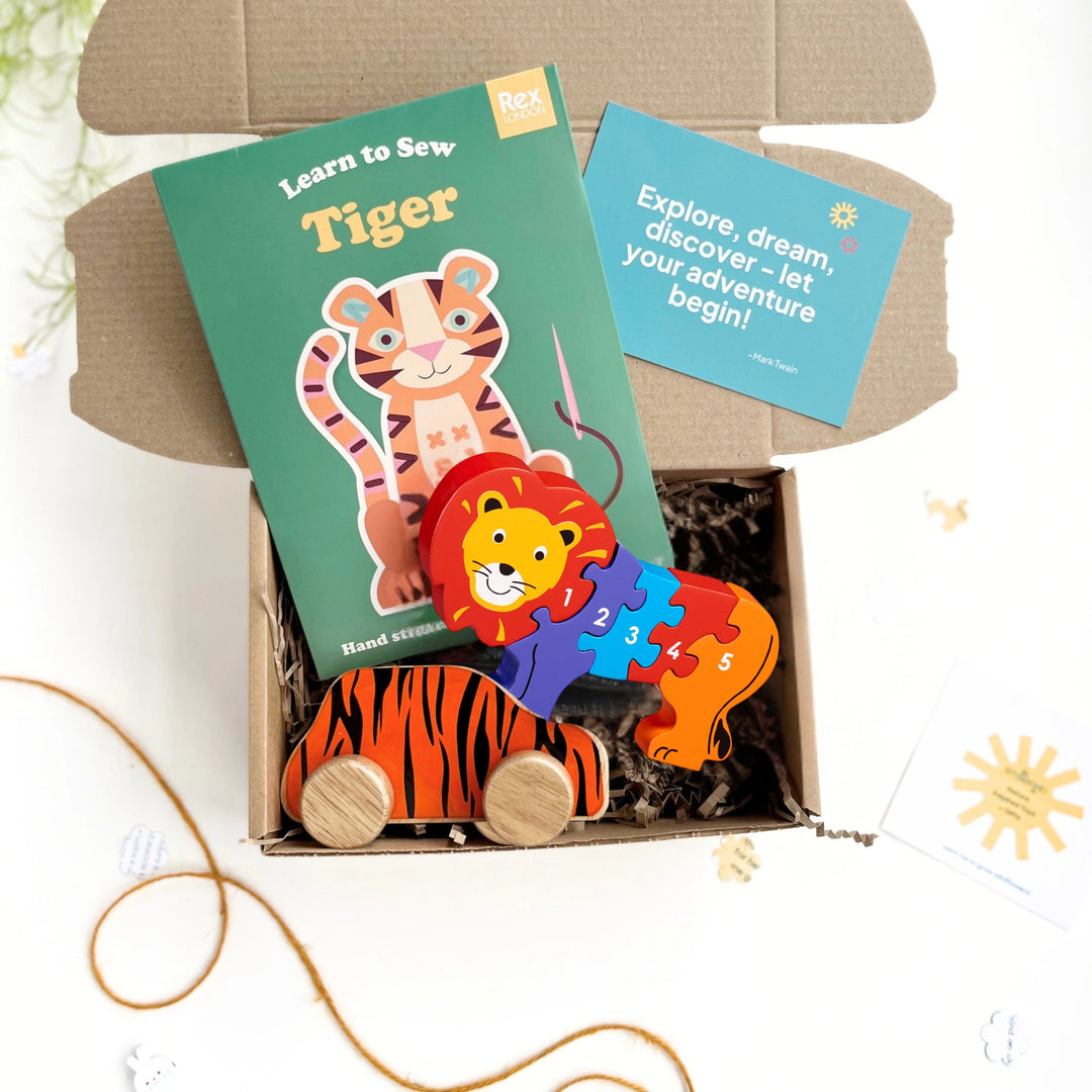 Children's lion and tiger themed educational toy set with craft kit, puzzle, and tiger car toy in a gift box.