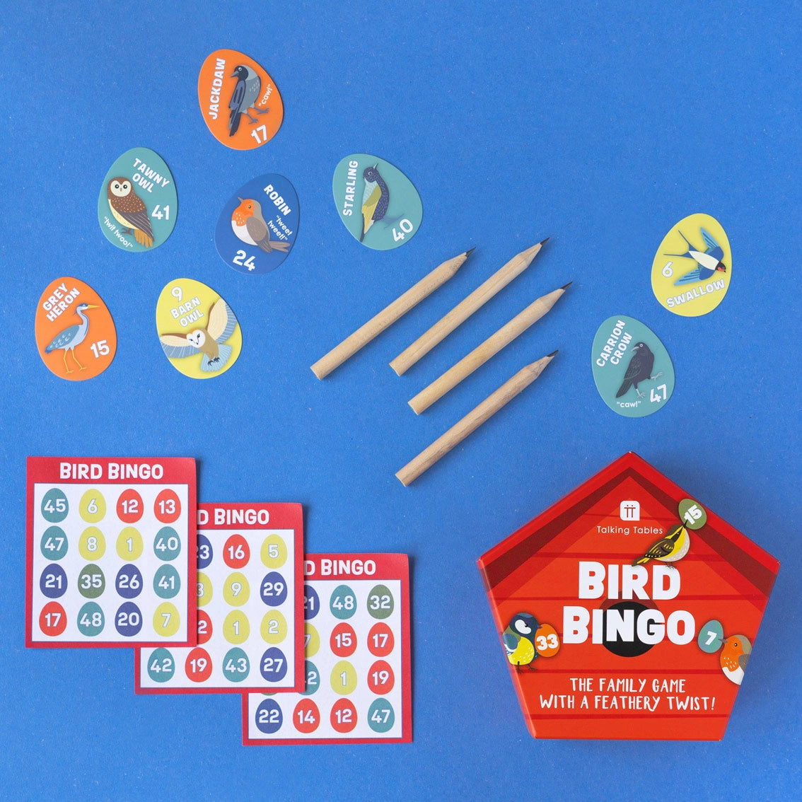 Bird-themed bingo game set with cards, markers, and a red box on a blue background