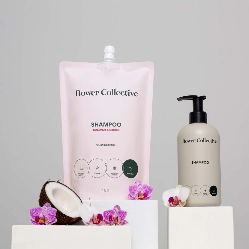 bower collective shampoo in a pink refill pouch with a grey reusable pump bottle