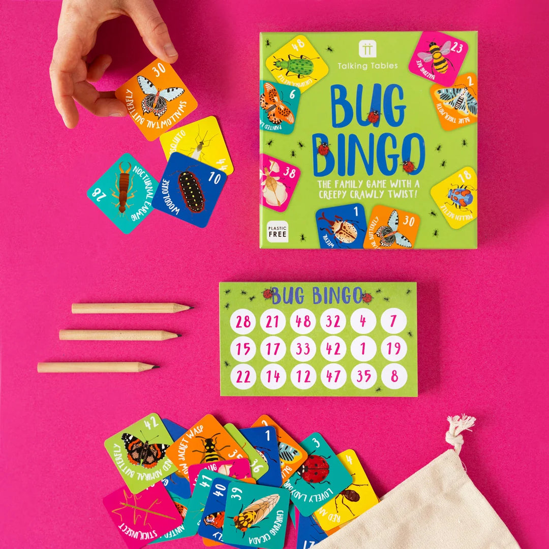 Bug Bingo game set with cards and packaging on a pink background