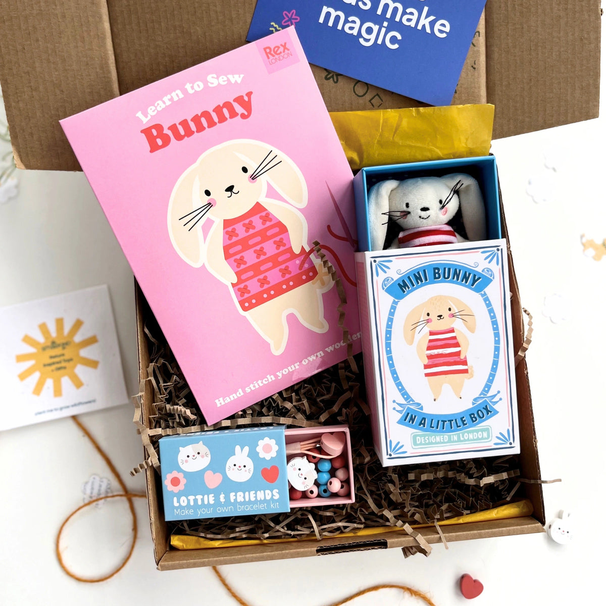 Eco Gift set for kids with a  'Learn to Sew Bunny', mini bunny toy in a decorative box and a bunny and cat themed jewellery making kit. 