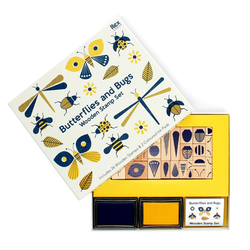 set of wooden stamps with different shapes and patterns to create butterflies and bugs. The set is presented in a yellow and blue gift box. 