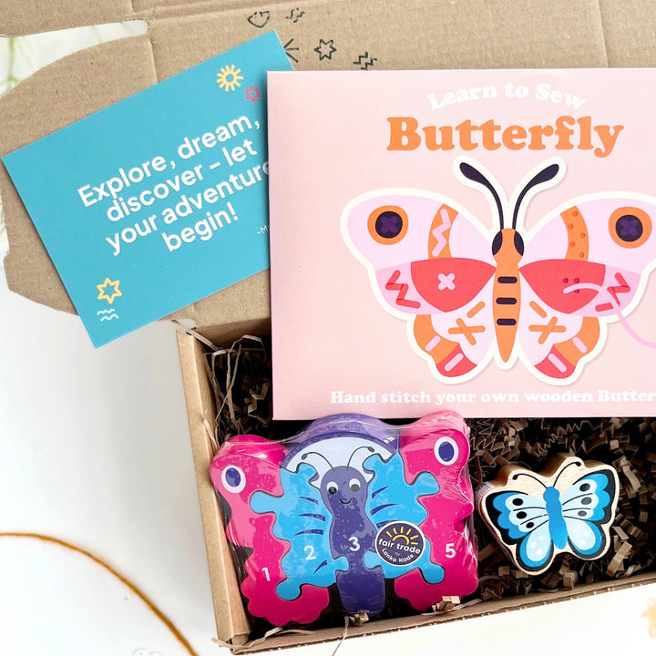Butterfly-themed craft kit with colourful butterflies craft kit, puzzle and play figure and a card on a light background