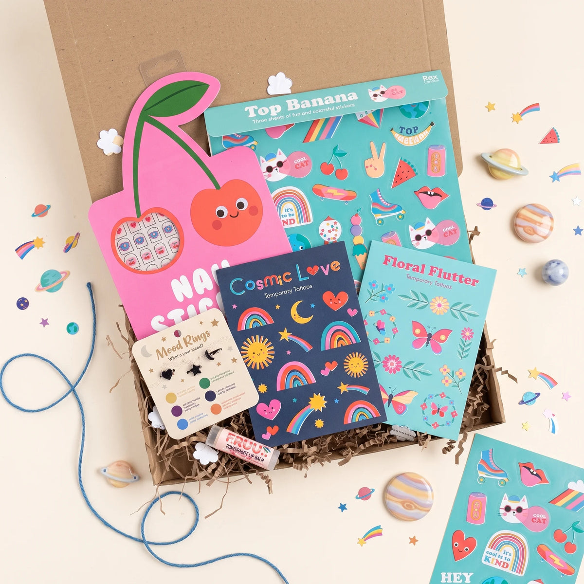 kraft gift box filled with children's temporary tattoos, nail art stickers, rings, lip balm and colourful stickers. Perfect gift for girls