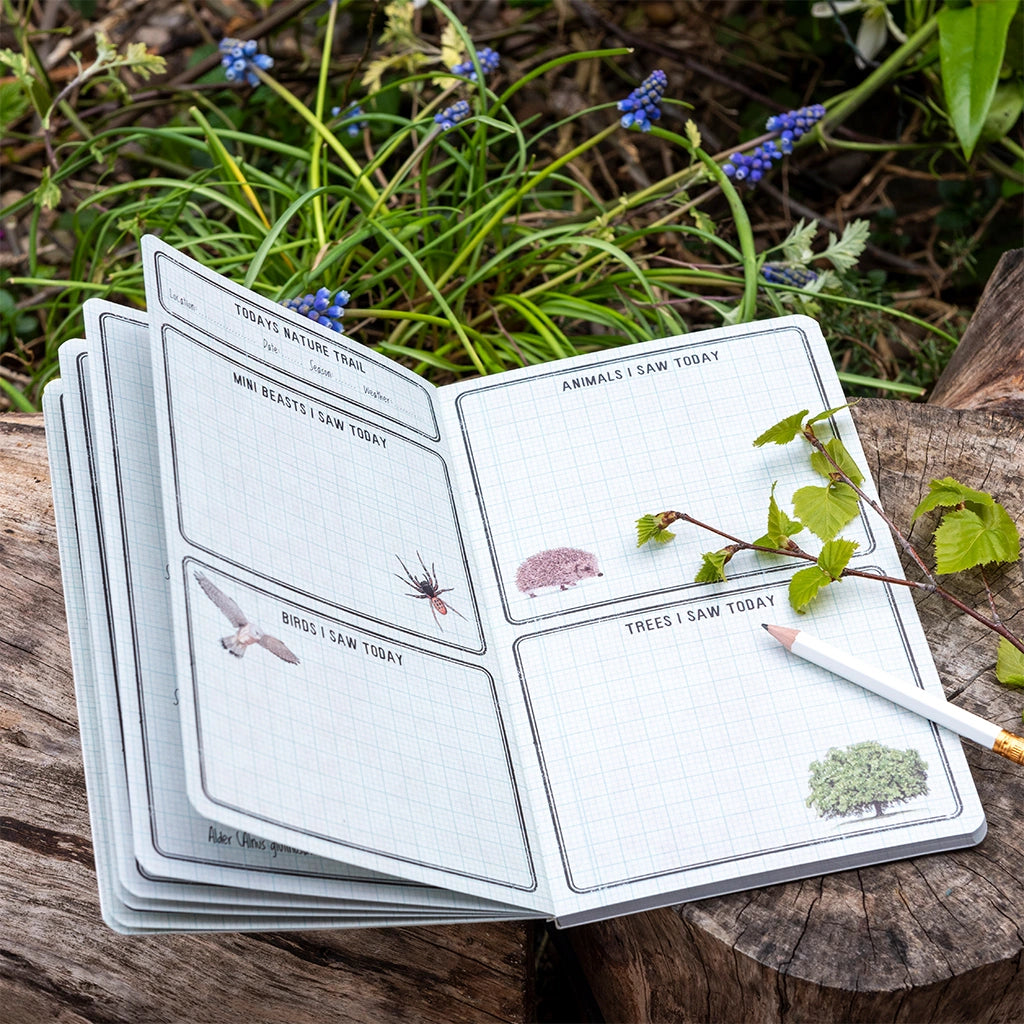 children's nature trail journal with illustrated pages for recording wildlife and outdoor adventures.
