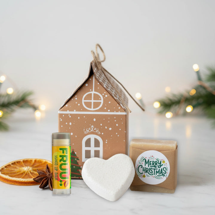 Gingerbread house Christmas beauty bauble a lip balm, soap, bath bomb on a light background with Christmas decorations.