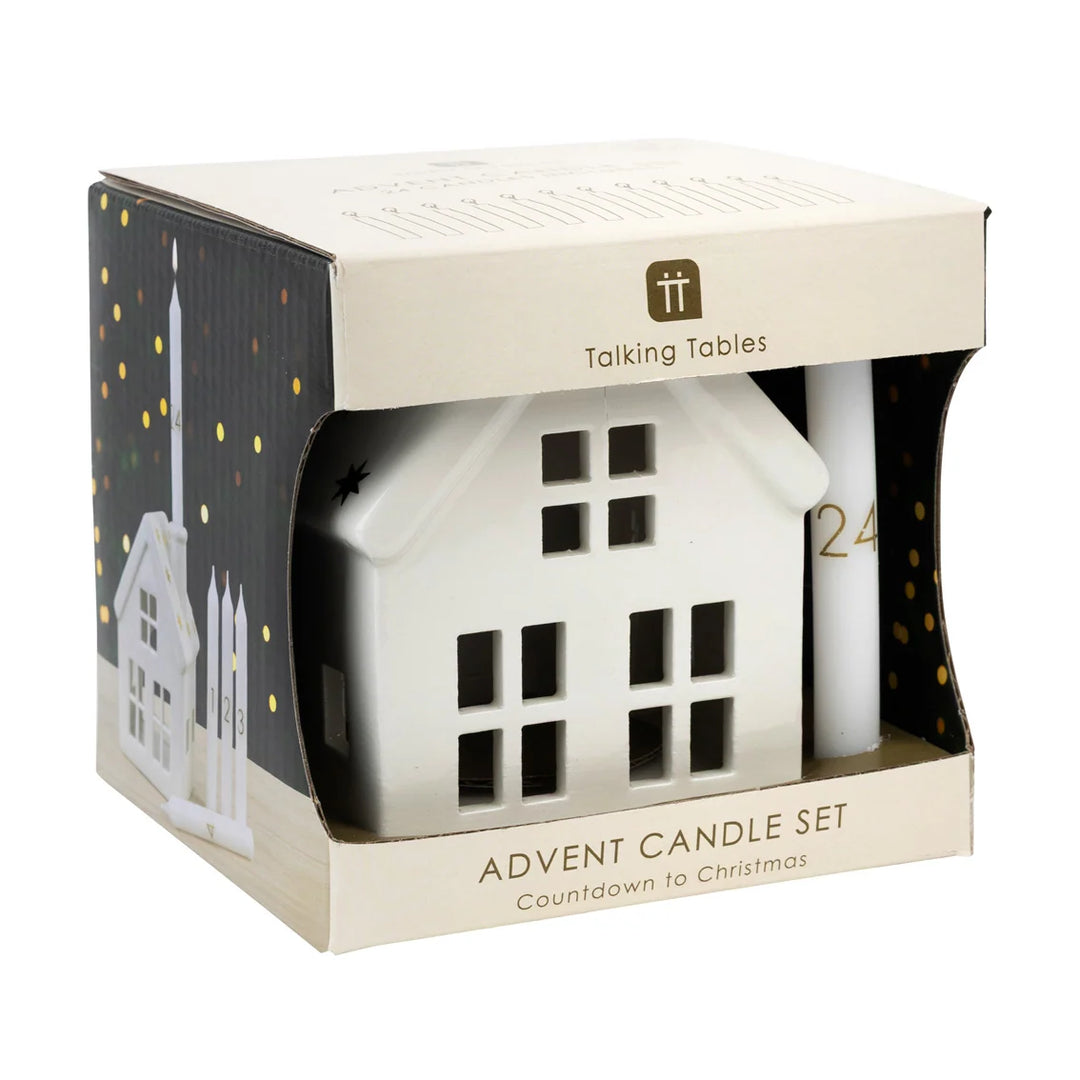 Talking Tables Advent Candle Set featuring a white house-shaped candle and a white cylindrical advent stick inside a cream-colored gift box with gold accents.