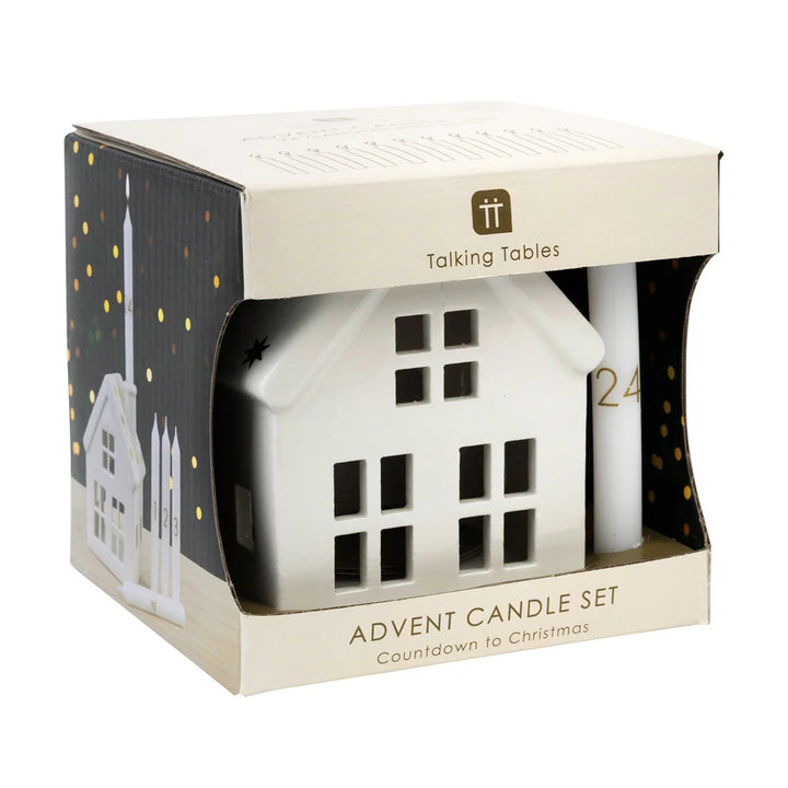 Talking Tables Advent Candle Set featuring a white house-shaped candle and a white cylindrical advent stick inside a cream-colored gift box with gold accents.