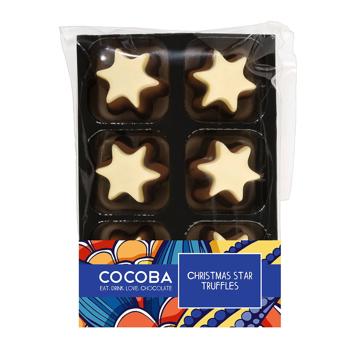 A package of COCOBA Christmas Star Truffles, featuring six star-shaped truffles (three dark chocolate, three white chocolate) in a clear plastic tray with a colorful patterned label at the bottom.