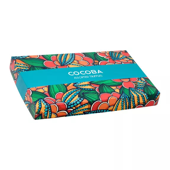 Colorful box of COCOBA truffles with floral design on a white background