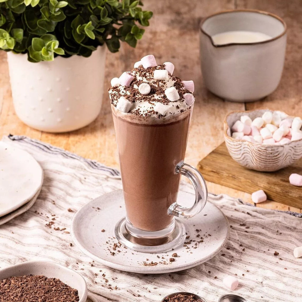 hot chocolate in a glass with marshmallows made with Cocoba hot chocolate gift tin