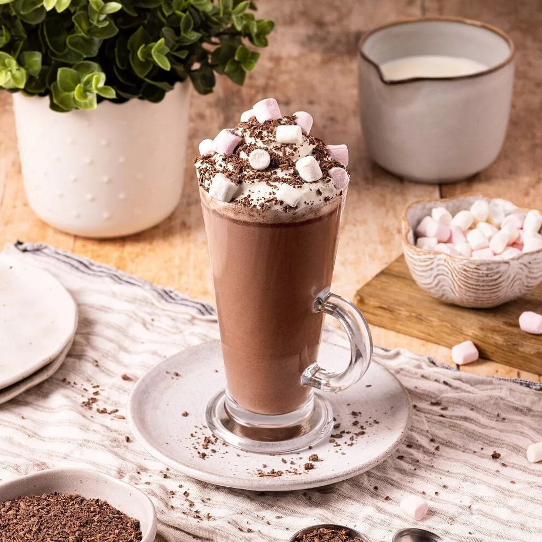 hot chocolate in a glass with marshmallows made with Cocoba hot chocolate gift tin