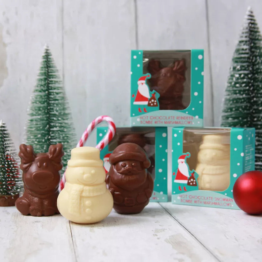 reindeer hot chocolate bomb with white chocolate snowman and chocolate santa