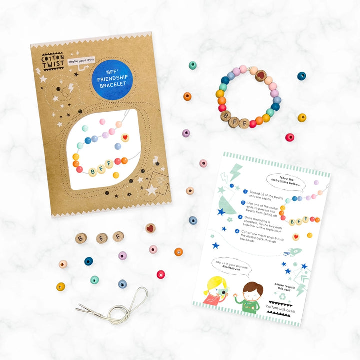 Colourful BFF friendship bracelet kit with packaging, beads, and instructions on a white background