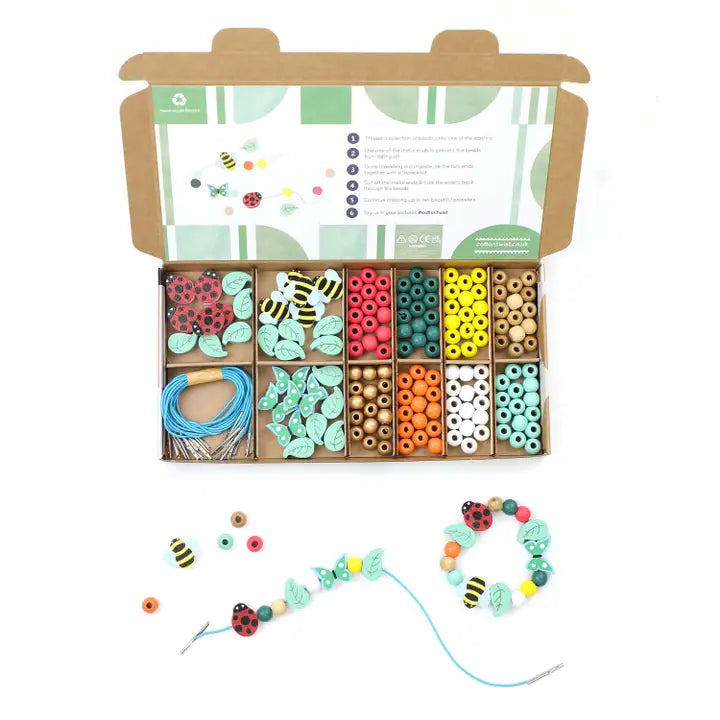 cotton twist minibeast bracelet making kit with colourful Beads and string set in a cardboard box on a white background