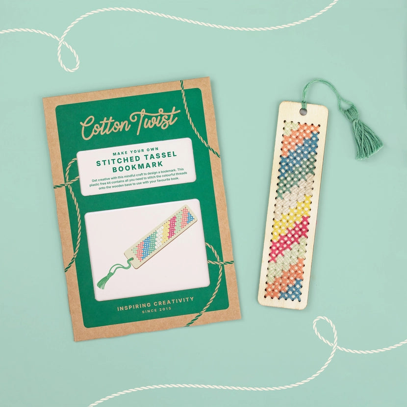 Cotton Twist stitched tassel bookmark kit with a completed bookmark on a light green background