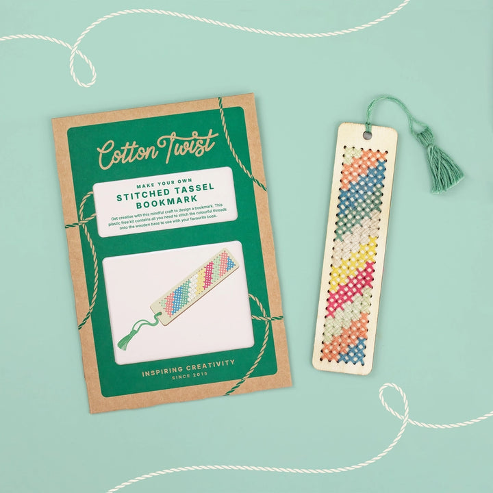 Cotton Twist stitched tassel bookmark kit with a completed bookmark on a light green background