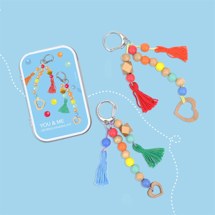 Colourful keychains with beads and tassels on a blue background