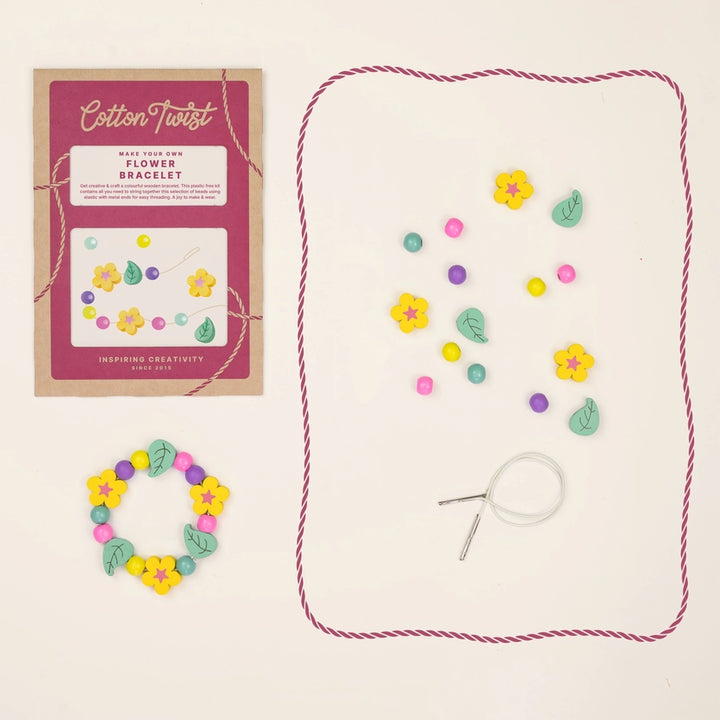 Cotton Twist flower bracelet making kit with packaging, beads, and tools on a beige background