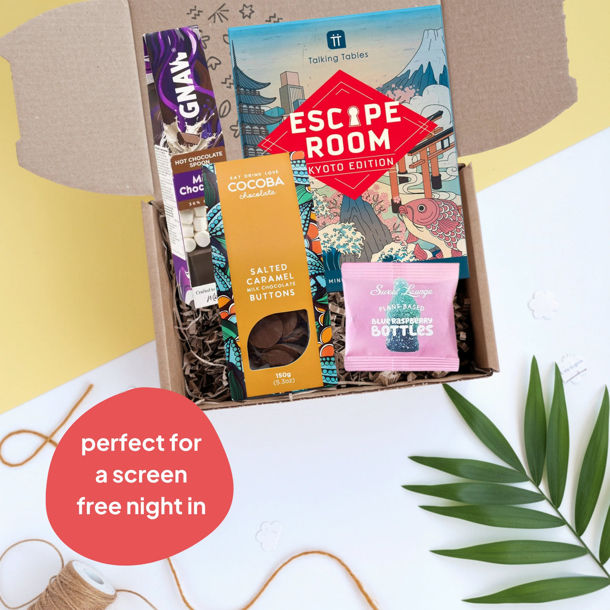 Box of snacks with 'Escape Room' game on a light background
