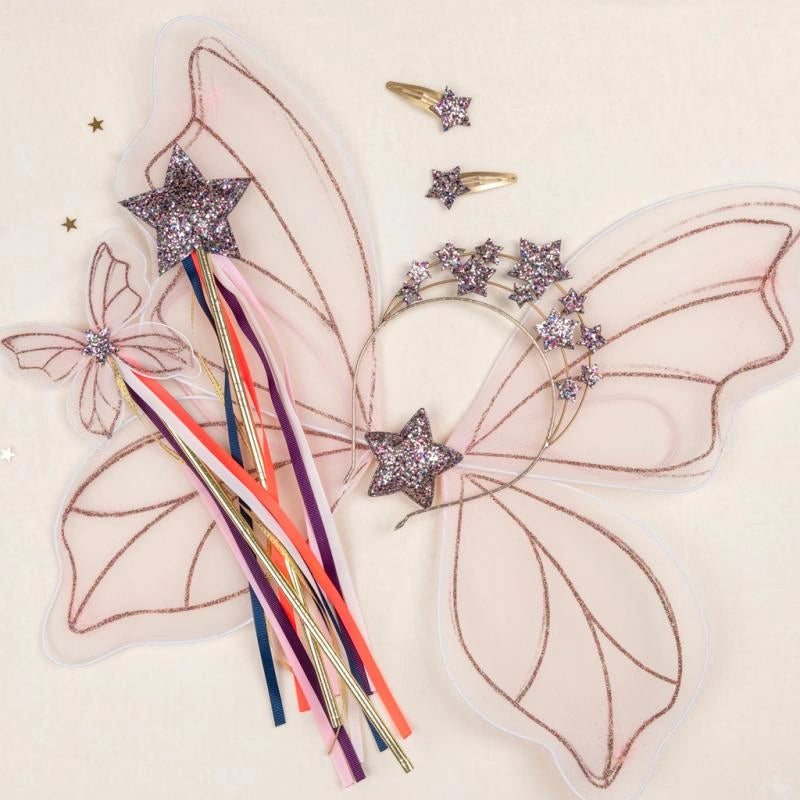 Fairy Wings, star crown and fairy wands Dress Up accessories on a pink background. For children aged 3 and over.