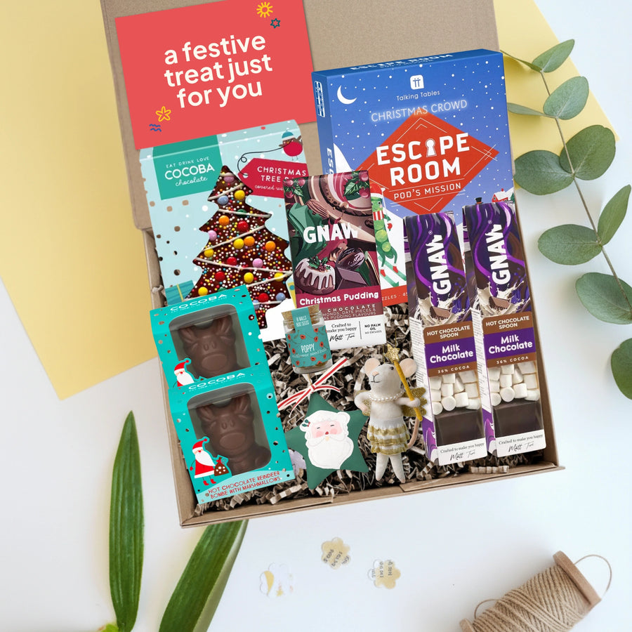 family Christmas hamper with festive chocolate bars, hot chocolate, a Christmas 'Escape Room', jar of wildflower seeds and a two Christmas decorations.