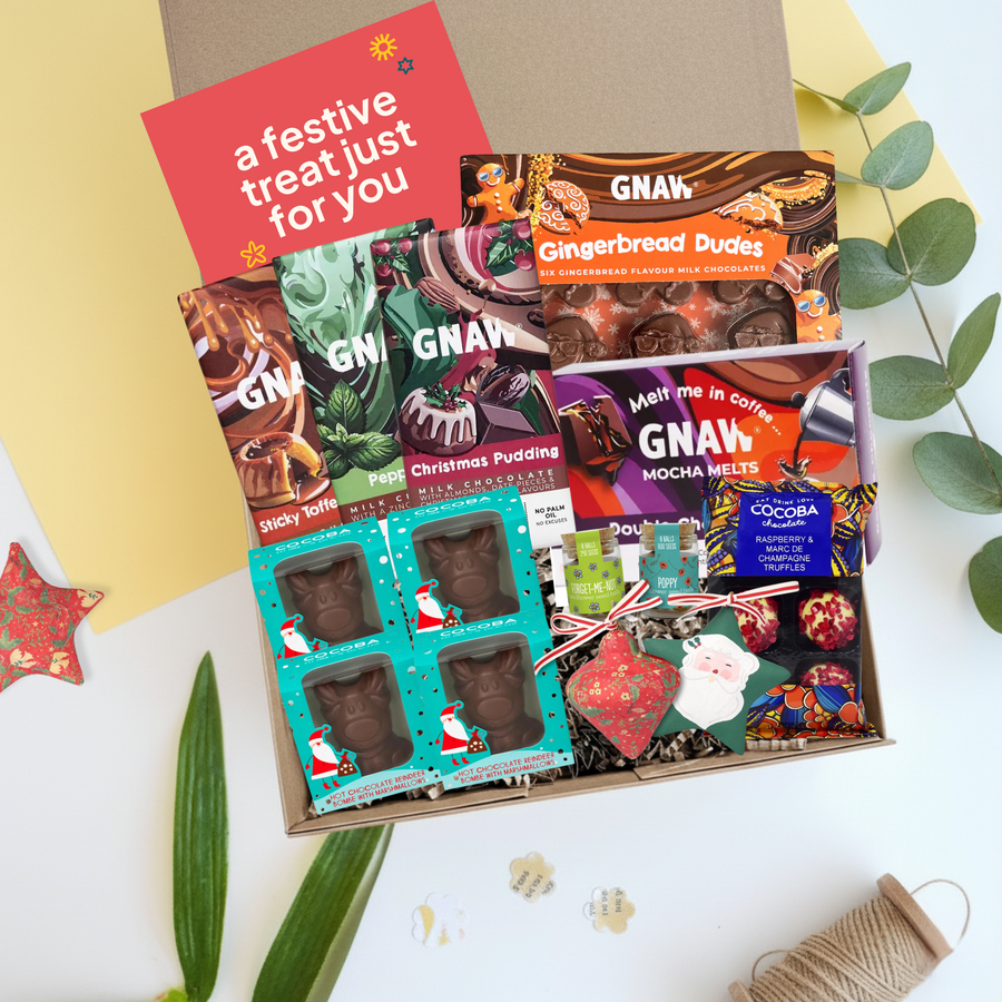 Team Christmas hamper filled with chocolate treats, seedballs and Christmas decorations with festive packaging on a white background