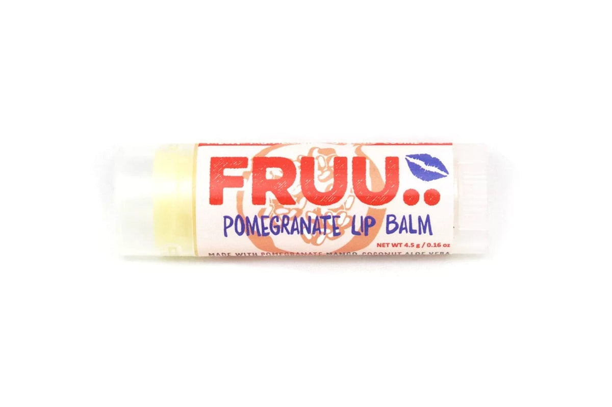 FRUU Pomegranate Lip Balm in a plastic tube with pomegranate design on the label. 