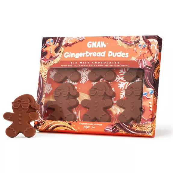 Chocolate gingerbread men with gift packaging on a white background