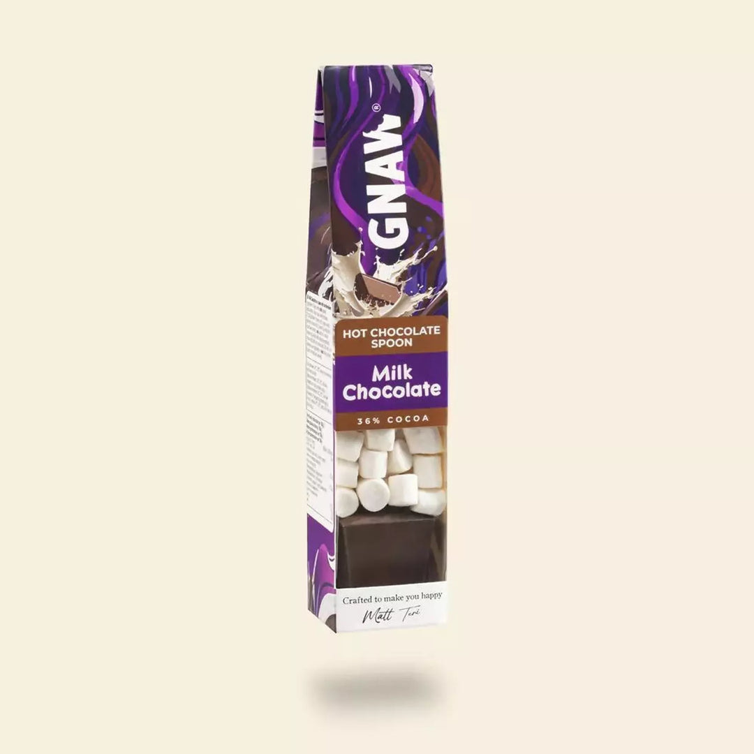 Box of GNAW Milk Chocolate Hot Chocolate Spoon with marshmallows  on a beige background