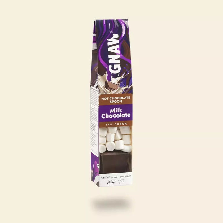 Box of GNAW Milk Chocolate Hot Chocolate Spoon with marshmallows  on a beige background