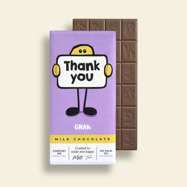 Gnaw Thank You Milk Chocolate Bar in a purple wrapper with a yellow stick man character holding up a thank you sign. There is a bar of milk chocolate in the background.
