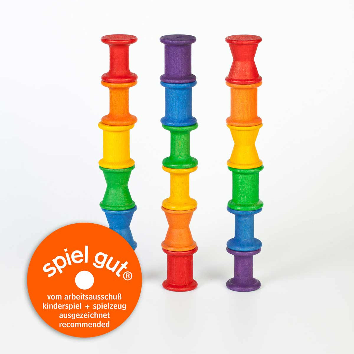 wooden spools in rainbow colours, for loose parts play