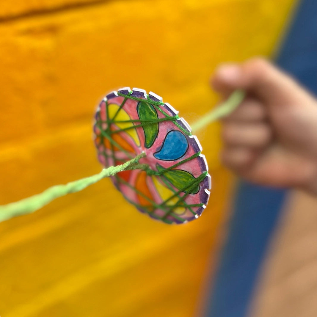 finished spinning toy made with the make your own spinning toys craft kit by Cotton Twist. 
