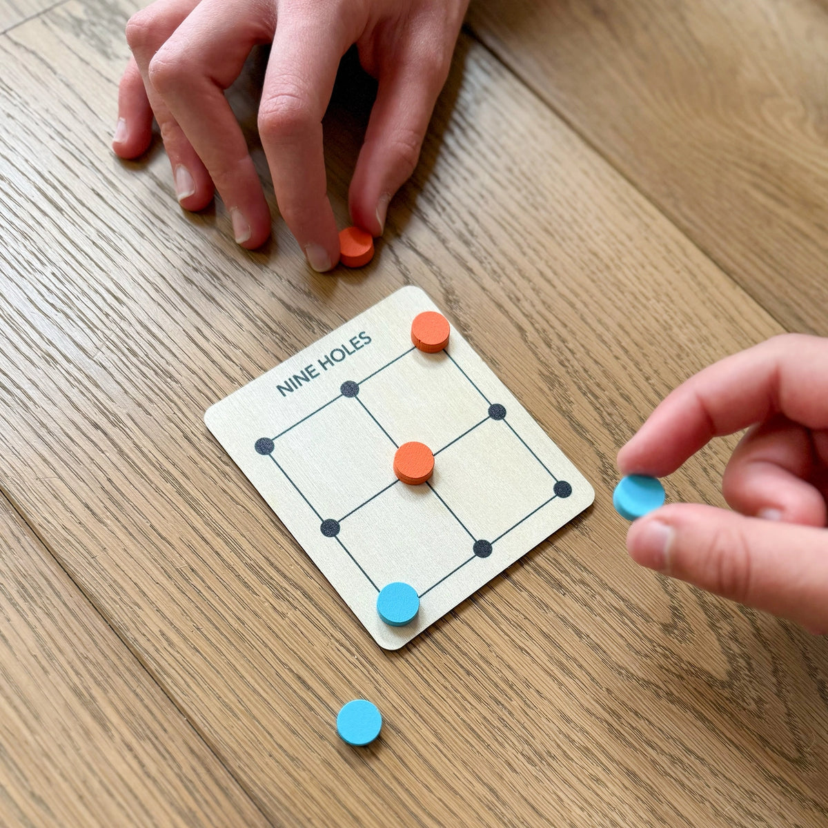 Game board with colorful markers on a wooden surface
