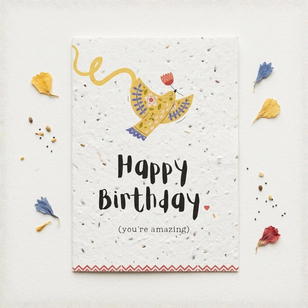 happy birthday card with a yellow folk inspired bird design and the words 'happy birthday (you're amazing) in a handwritten style font. 