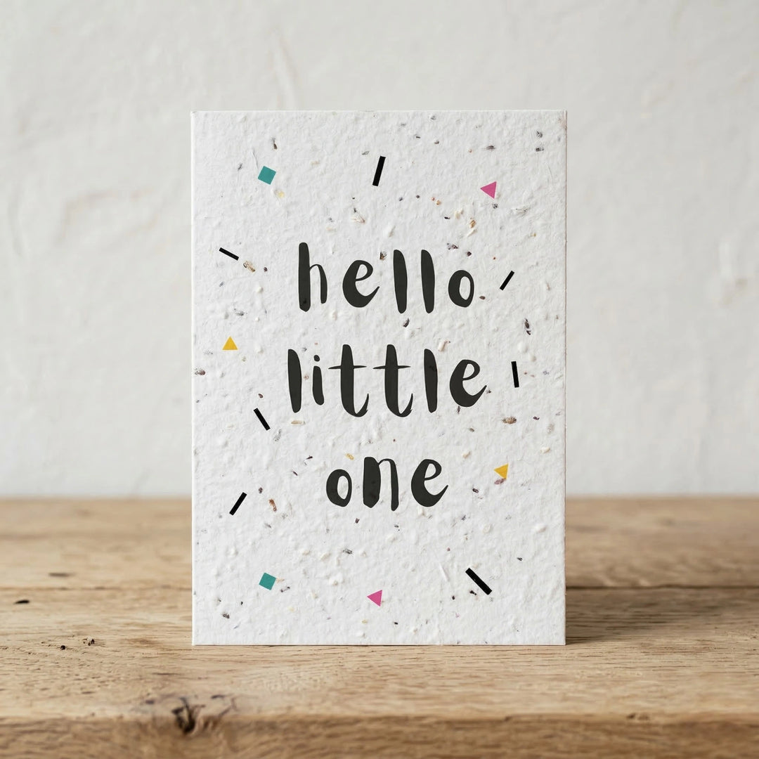Greeting card with 'hello little one' text on a textured surface